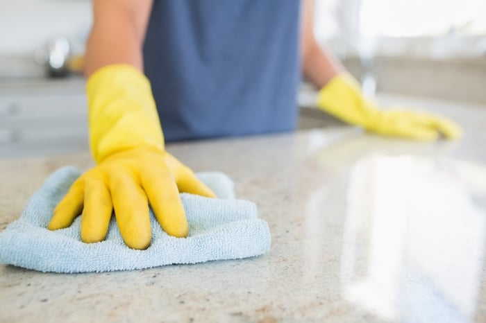 Woman cleaning the counter  in the kitchen.jpeg