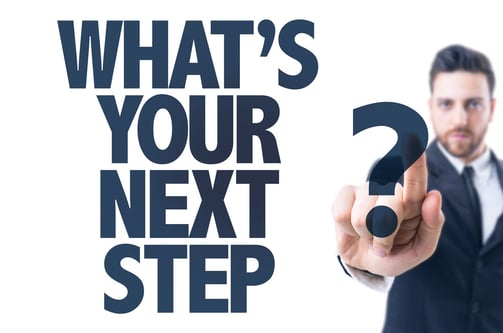 Business man pointing the text What's Your Next Step_.jpg